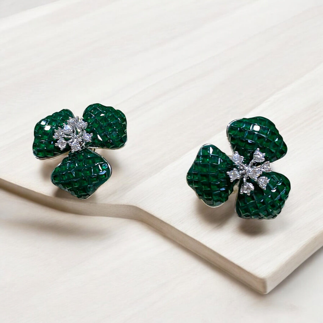 Green earrings.