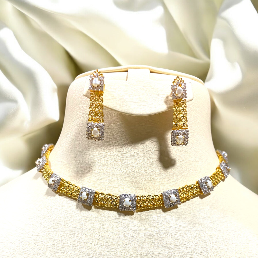 Short pearl necklace and earrings.