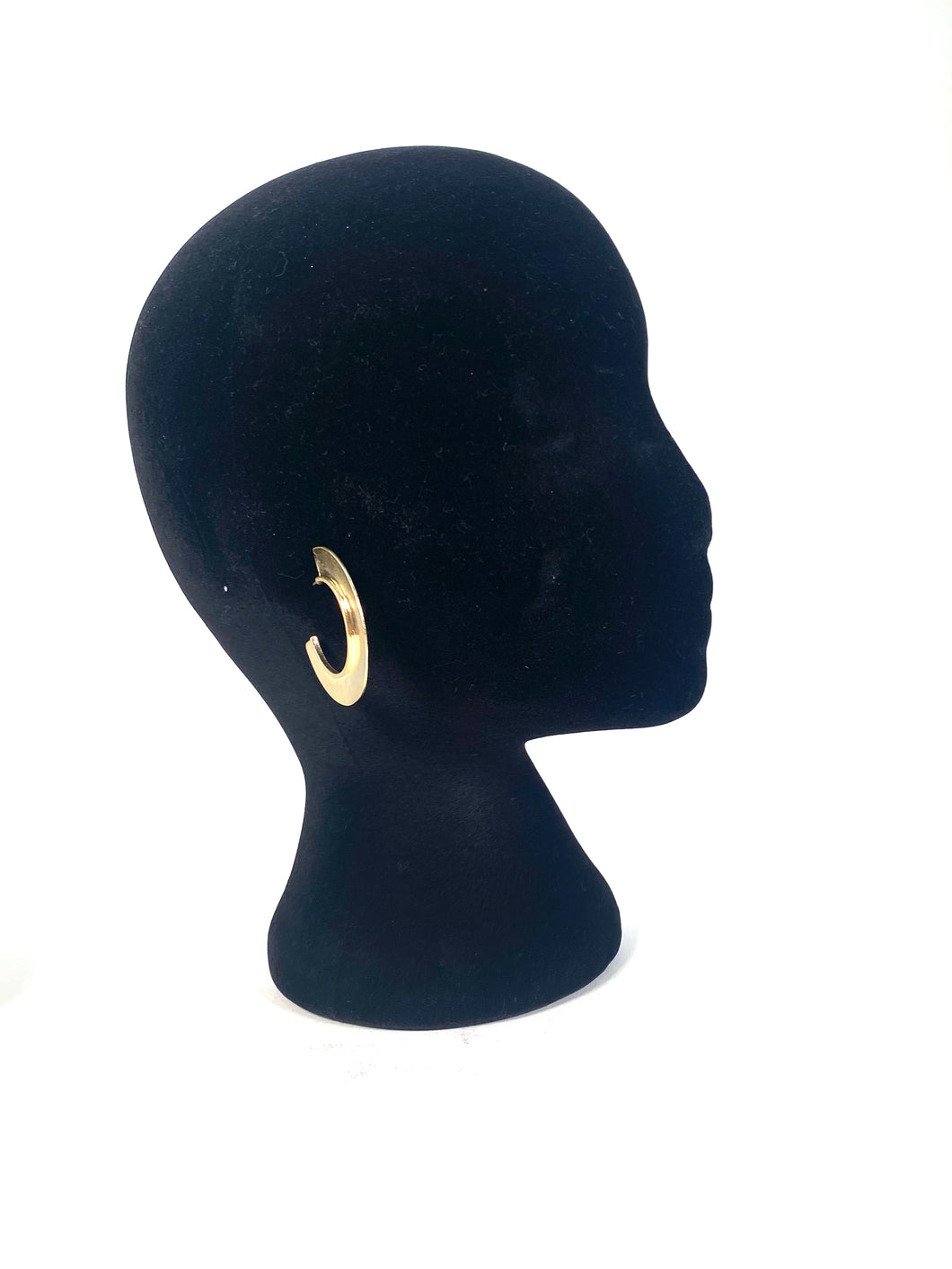 Gold color hoop earrings.