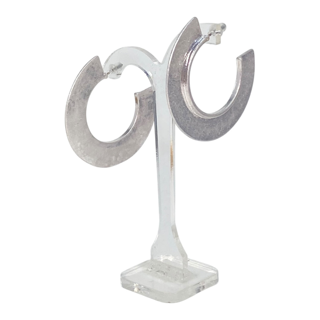 Silver color hoop earrings.