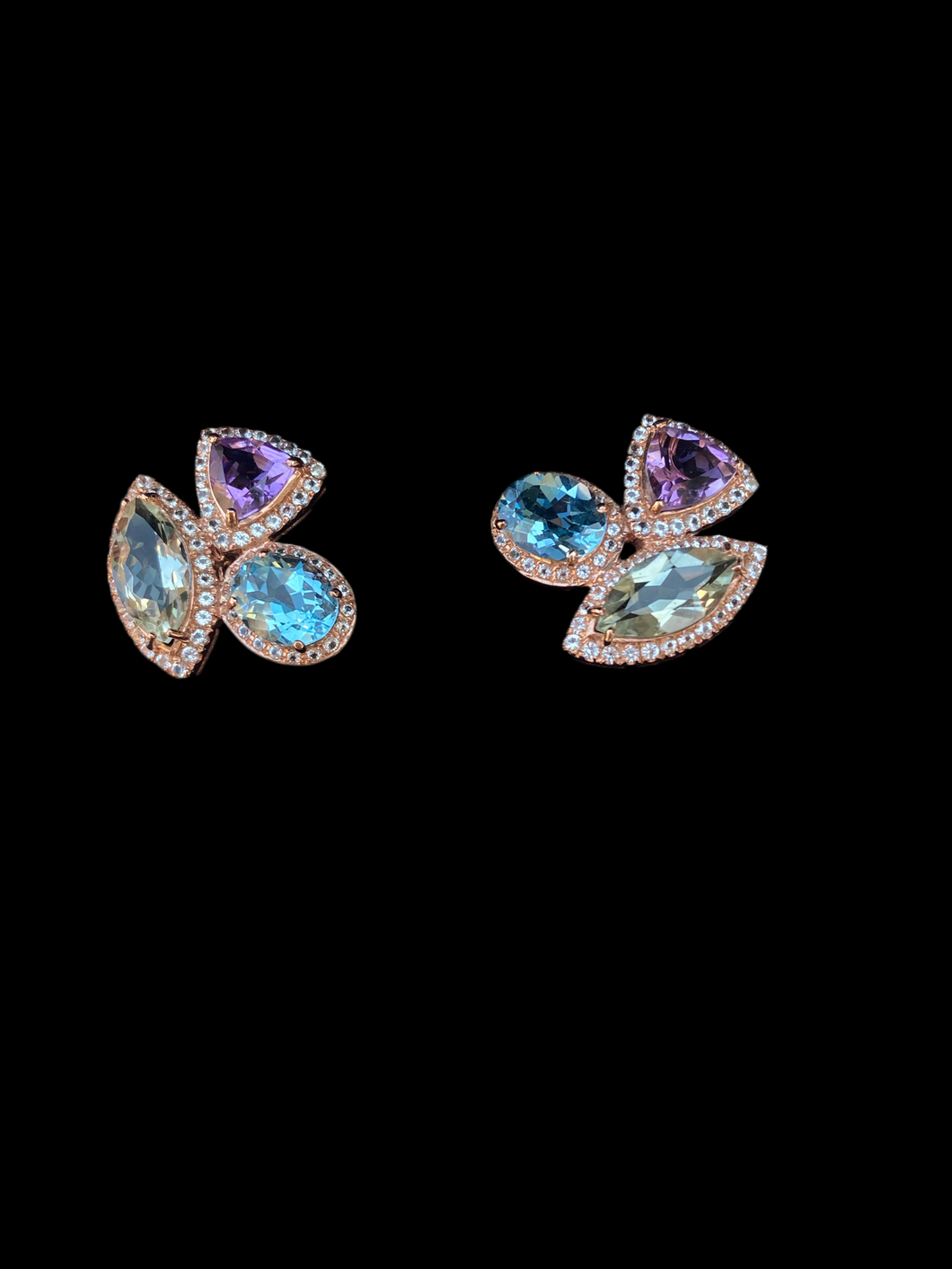 Earrings with amethyst topaz and sapphire. أقراط من التوباز الجمشتي والياقوت.