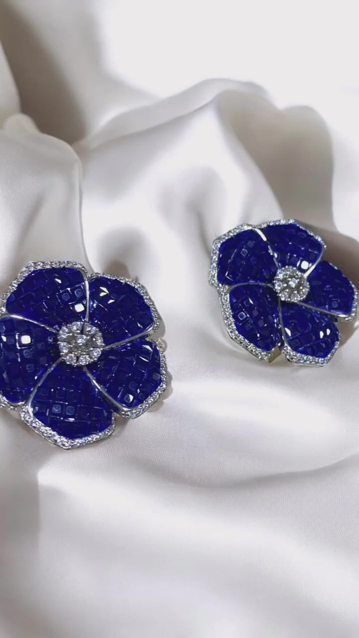 Blue flower earrings.