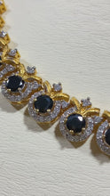 Load and play video in Gallery viewer, Black stones and zircon. Gold plated.
